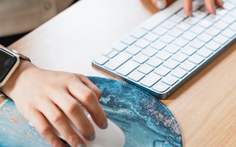 Kathy's holding her mouse and keyboard.