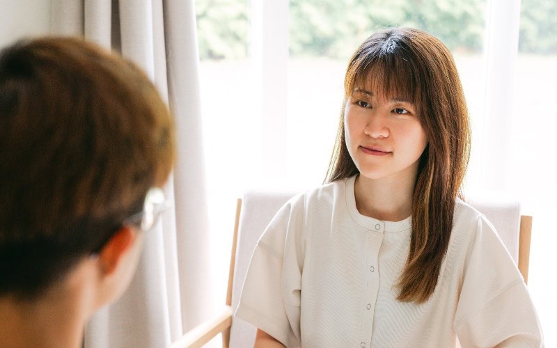 Kathy consulting an individual.